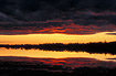 Mid-night sun at lake in Finnish Lapland