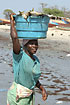Woman carrying fish