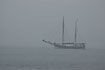 A sailing ship in the mist