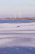 Frozen lake with windmills