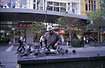 Old mand feeding pigeons in Bourke Street