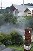 Maori village - boiling water rises behind statue