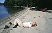 Relaxation and sunbathing at the lake after a long hike