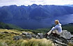 Woman enjoying the alpine view of mountains and Lake Te Anau
