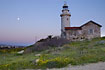 Sunset at Paphos lighthouse with the moon rising