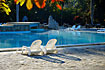 Swimmingpool and deck chairs at "Hotel & Villas Soroa"