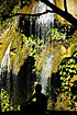 Silhouette of woman at a waterfall