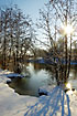 Snow and sun at the river Odense 