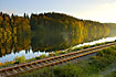 Railway tracks at swedish lake at sunset