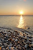 Sunset at stony shore