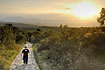 Boy walking towards his mother and the sunset