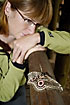 Woman looks at a huge emperor moth
