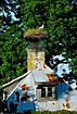 Stork nest on top of a chimney on an old house