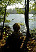 Boy at the edge of lake in silhoutte