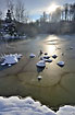 Winter sun at frozon lake