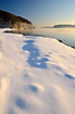 Shadows in the snow and fog over the Lilleblt waters