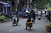 Vietnamese woman crossing a street in Hanoi