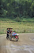 Lao women dragging a wagon