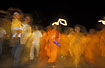 Monks at night near Pha That Luang