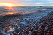 Sunrise at a stony beach