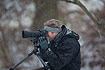 Naturephotographer during snowfall