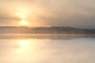 Hazy sunrise over a Danish lake