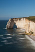 The beautiful limestone cliffs at tretat i Normandy. The waves apear silky due to the use of a long exposure time.