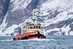 Tug boat on norwegian fiord by the Barents Sea