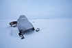Snow mobile in a rough barren winterlandscape in northern Norway