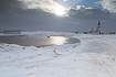 Winter landscape by the Varanger Fiord with the picturesque Nesseby Church