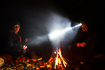 Two boys enjoying a campfire