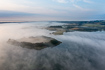 Morning mist over Skanderborg Lake in Denmark