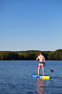 Young lad on a stand up paddle board (SUP)