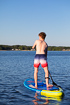 Young lad on a stand up paddle board (SUP)
