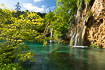 Crystal clear lake and waterfall in Plitvice National Park in Croatia