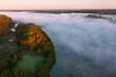Misty autumn morning by af Danish Lake. Drone photo.