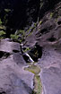 Natural mountain stream running on bedrock in a Barranco