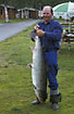 Salmon from the river Orkla in the hands of the happy angler