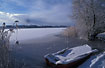 Rowboot and snowcovered lake