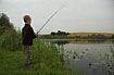 Boy fishing at a pond