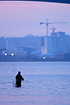 Sportfisher in Vejle Fjord with the city in the background