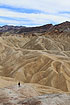 A person looking out over the badlands at Zabriskie Point in Death Valley, CA, USA