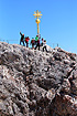 A queue is forming with people waiting to reach the summit of Zugspitze, the tallest mountain in Germany.
