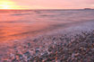 Sunrise at a stony beach