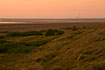 Sunset over tidal meadow on Mand with Vestkraft powerplant (Esbjerg) in the background